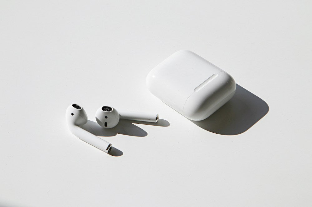 airpods out of case on white background