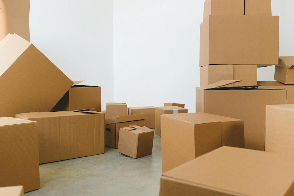 Sustainable shipping boxes piled in a room