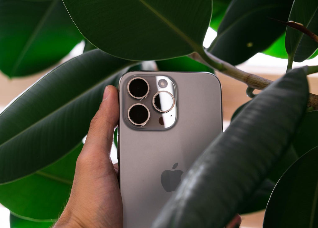 iPhone 16 being held showing the camera side