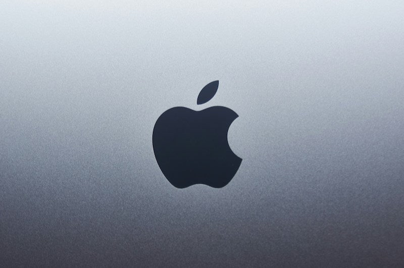 Apple logo on a silver grey background